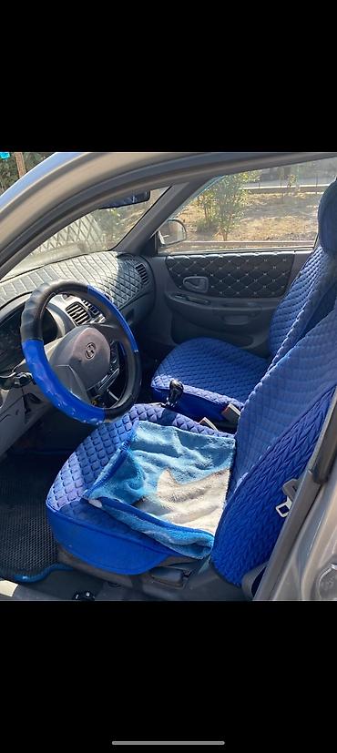 wuling mini ev: Седан серебристого цвета, 4 двери, кузов компактного класса. Кузовные — 5