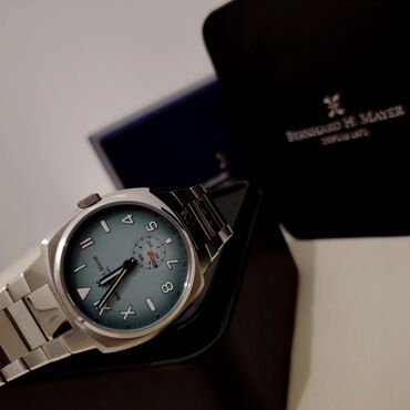 qarin piylerini eritmek üçün idman: Наручные часы, Bernhard Mayer