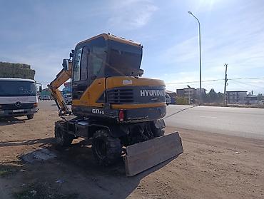 е34 4 4: Экскаватор, Hyundai, Колесный — 2