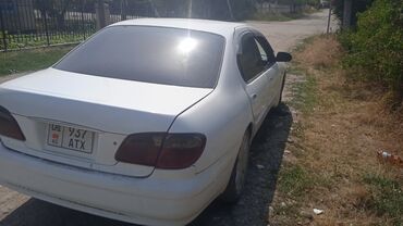 авто лизинг рассрочка: Седан Nissan Cefiro белого цвета. Автомобиль оснащен автоматической