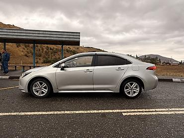 краун 2023: Toyota Corolla: 2021 г., 1.8 л, Вариатор, Гибрид, Седан — 4