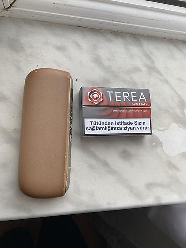 qizilar: IQOS Terea uyğun tütün qızdırma qurğusu Məhsulun tərkibi: - IQOS — 3