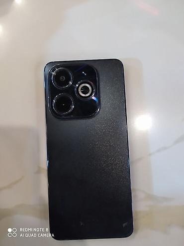 magic 6 pro: Smartfon – 6.6” ətrafı ölçüdə tam ekranlı, mərkəzə yaxın “punch‑hole” — 1