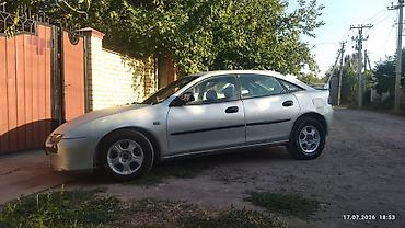 мини электро: Mazda 323: 1996 г., 1.6 л, Механика, Бензин, Хэтчбэк — 1
