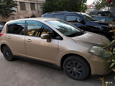 vectra stop: Nissan Tiida – hetçbek - Kuzov: 5 qapılı hetçbek, qızılı rəng - — 1