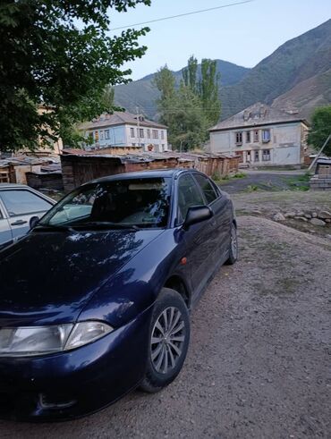 митцубиси спейстер: Автомобиль Mitsubishi Carisma в кузове седан, выполненный в