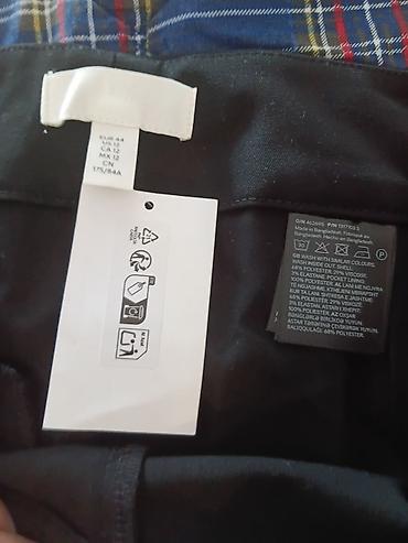 Pantalone: H&M Crne elegantne ženske pantalone sa širokom nogavicom. Model — 7