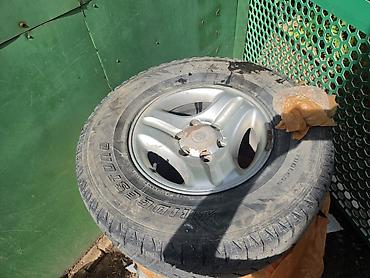 70: Колесо в сборе: шина Bridgestone Dueler A/T и литой диск Toyota — 1