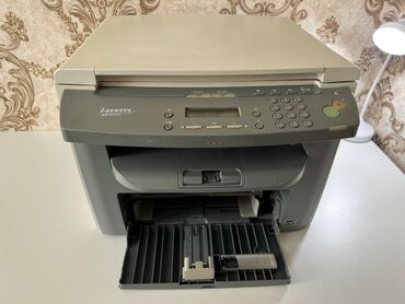 Принтеры: Продаётся б/у многофункциональный принтер Canon i-sensys MF4010 МФУ