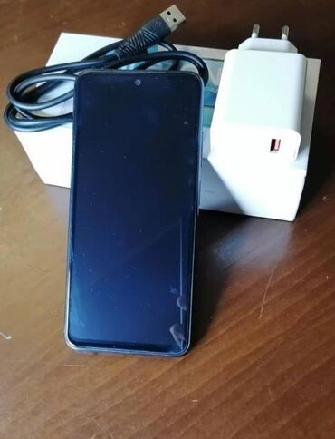 телефон fly iq446 magic: Xiaomi Redmi Note 10, 128 ГБ, цвет - Черный, 
 Отпечаток пальца, Две SIM карты, С документами
