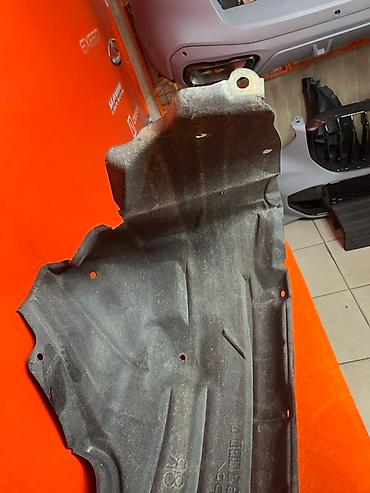 Подкрылки, брызговики, защита днища: Подкрылок колесной арки черного цвета, изготовленный из прочного — 5