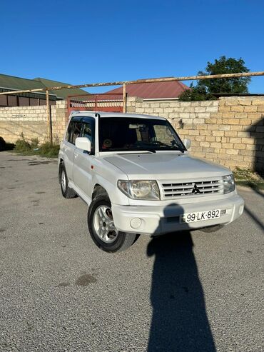 disk qapagi: Mitsubishi Pajero iO (qısa kuzov), ağ rəng - 4WD “Super Select” tam