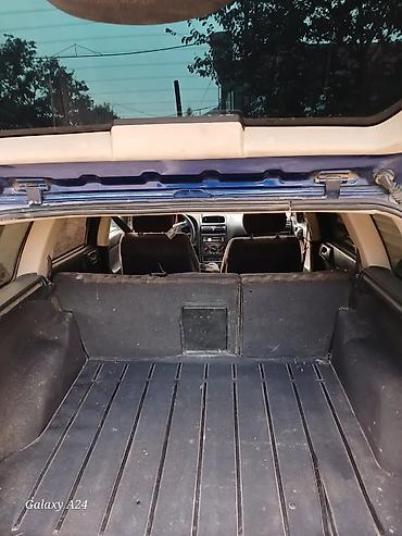 Продажа авто: Opel Astra Caravan (universal), mavi rəng. - Kuzov: universal, dam — 7