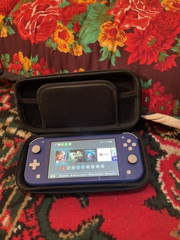 монитор 34 дюйма: Портативная игровая консоль Nintendo Switch Lite фиолетового цвета