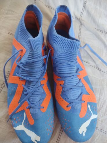 ракетка настольного тенниса: Футбольные бутсы Puma Ultimate FG/AG в сине-оранжевой расцветке