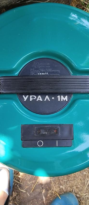 намотка: Пылесос "Урал-1М" с характерным цилиндрическим корпусом, выполненный в — 4