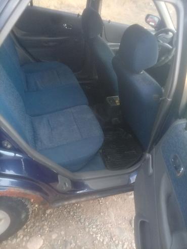 губа 211: Mazda 323: 2000 г., Механика, Бензин — 9