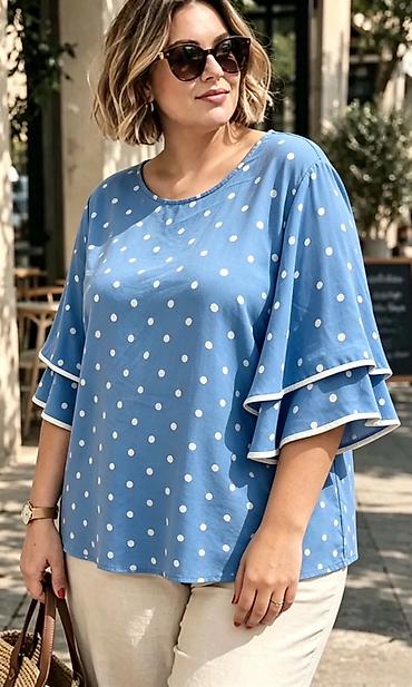 bele bluze: Ženska bluza sa tufnama – model sa karner rukavima
2000
Din
Do xxl — 1