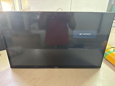 экран вента: Телевизор YASIN, диагональ около 32" (визуально). Плоская LED‑панель с — 1