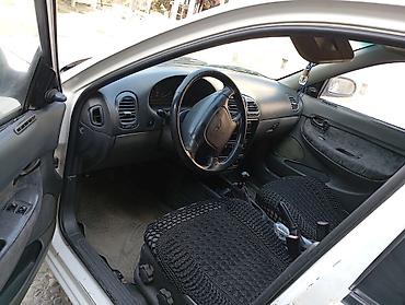 Daewoo: Daewoo Nubira sedan - Kuzov: 4 qapılı sedan, ağ rəng - Ban dizaynı — 13