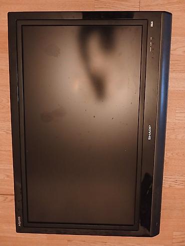 gencede televizor: Sharp AQUOS LCD televizor Xüsusiyyətlər: - Ekran: təxminən 32" — 1