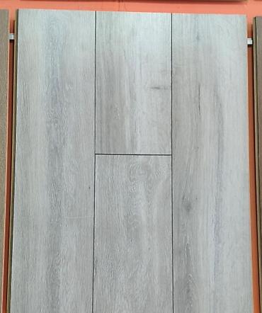 Açıq boz tonlarda, taxta fakturalı döşəmə örtüyü (laminat panel) lalafo.az -da Açıq boz tonlarda, taxta fakturalı döşəmə örtüyü (laminat panel)