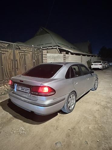 audi 100: Mazda 626: 1997 г., 1.8 л, Механика, Газ, Седан — 3