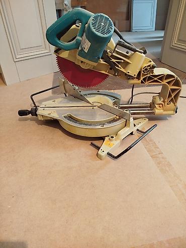 dərəcə kəsən: Makita sürüşdürülə bilən künc kəsən mişar (sliding compound miter saw) — 3