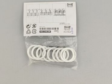 Zestaw nowych, białych pierścieni do zasłon SYRLIG z IKEA. Idealne do