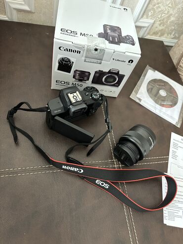 mini dv видеокамера: Canon m50. Her sey daxil. Heç bir problemi yoxdur. Cox az istifade
