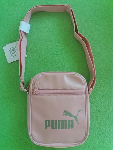 elegantna roze haljinica: Puma torbica nova original.
Roze boja.
1500din.
061/