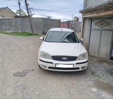 Ford: Ford Mondeo universal avtomobili satılır. Ağ rəngdədir və geniş yük