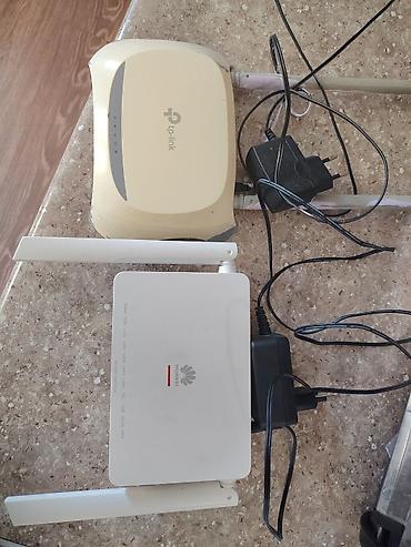router 2 antenna: İki ədəd Wi‑Fi router/ONU dəsti 1) TP‑Link router - İki xarici — 3