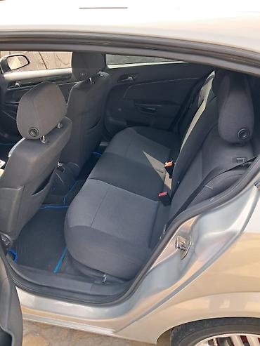 Opel: Opel Astra H – 5 qapılı hetçbek Xüsusiyyətlər: - Kuzov: 5 qapılı — 8
