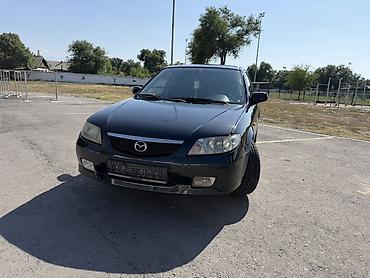Транспорт: Mazda 323: 2002 г., 1.6 л, Механика, Бензин, Хэтчбэк — 1