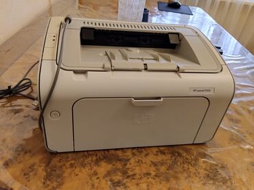 toshiba noutbuk: Hp laserjet P1005 ev şəraitində çox az işlənib ağ - qara çap edir