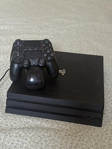 видио игры: Игровая консоль PlayStation 4 Pro (черная) с аксессуарами — 2