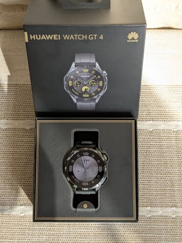 Huawei: Умные часы Huawei Watch GT 4 в классическом черном корпусе. В