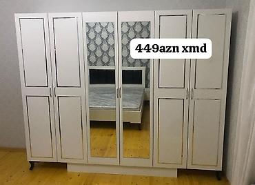 taxta qapilar: Ağ rəngdə 6 qapılı yataq otağı dolabı. Orta hissədə 2 ədəd boy güzgüsü — 1