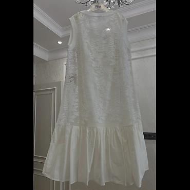 xaç: Ağ rəngdə, qolsuz, A-kəsimli yay donu. Üst hissə şəffaf tül/organza — 2