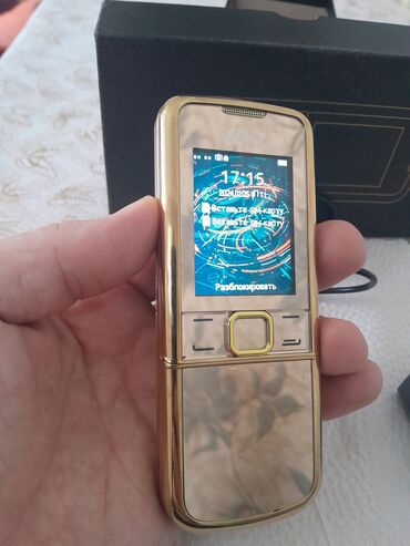 Digər mobil telefonlar: Qızılı korpuslu sürüşdürmə mexanizmalı düyməli mobil telefon — 2