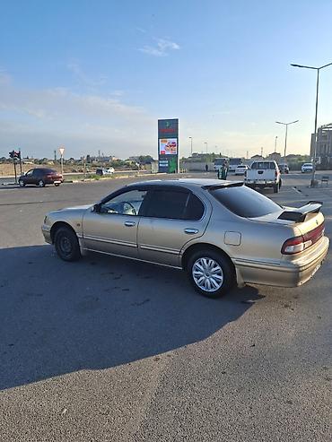bmw e 38: Nissan Maxima: 3 l | 1999 il Sedan — 4