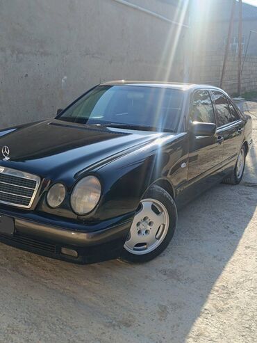 Mercedes-Benz: Mercedes-Benz 240: 2.4 l | 1991 il Sedan