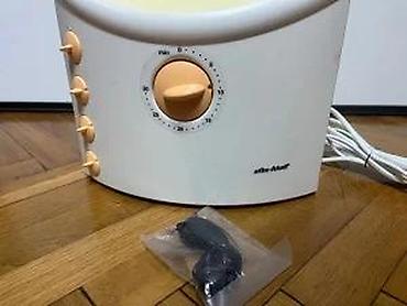 Ostali aparati za negu lica: Solarijum lampa za lice (kućni mini-facial tanner) Opis: - Kompaktna — 20