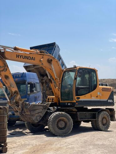 куплю электроскутер бу: Экскаватор, Hyundai, 2012 г., Колесный