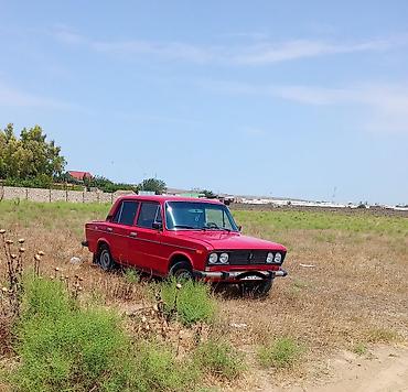 vaz 2106 abisovkasi: VAZ 2106 sedan, qırmızı rəng. Salon qara rəngli elementlərlə, ön — 3