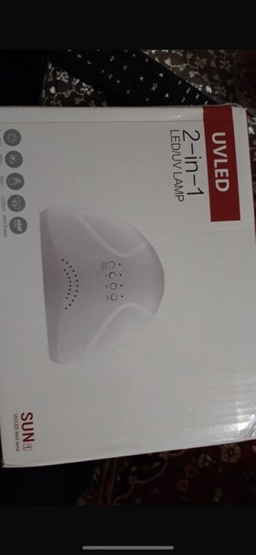 Dırnaq qurutma lampaları: SUN1 markalı 2-in-1 LED/UV lampası. Bu lampa, dırnaqlarınızı ev
