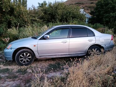 меняю на дом: Серебристый седан Honda Civic с затемненными окнами и декоративными