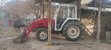 Тракторы ДТ-75: Трактор с фронтальным погрузчиком и навесным оборудованием Описание — 7