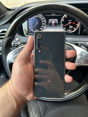 xiaomi mi a x: Xiaomi Mi 9 SE, 64 ГБ, цвет - Серый, 
 Отпечаток пальца, Две SIM карты, Face ID
